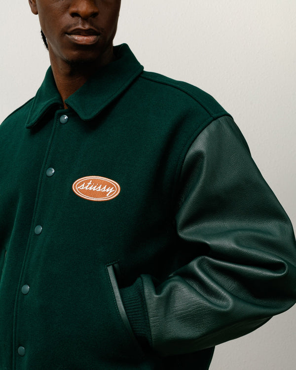 CHAQUETA UNIVERSITARIA OVALADA SCRIPT